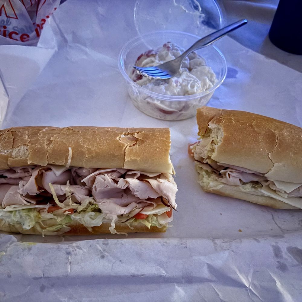 A classic turkey sub with soft delicious bread and red skin potato salad A classic turkey sub with soft delicious bread and red skin potato salad