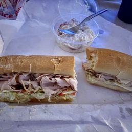 A classic turkey sub with soft delicious bread and red skin potato salad A classic turkey sub with soft delicious bread and red skin potato salad