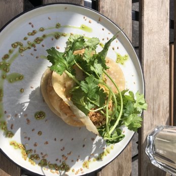 GRÅDI - Ramsløkshummus tostada (3 layers of fried tortilla with hummus and puréed greens) - Bars Near Me - Oslo, 03 GRÅDI - Ramsløkshummus tostada (3 layers of fried tortilla with hummus and puréed greens) - Bars Near Me - Oslo, 03