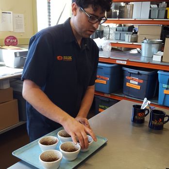 Water Street Coffee Roaster - Seth teaching us about cupping and the 2 kinds of coffee we tried. - Coffee Roasteries Near Me - Kalamazoo, Michigan Water Street Coffee Roaster - Seth teaching us about cupping and the 2 kinds of coffee we tried. - Coffee Roasteries Near Me - Kalamazoo, Michigan