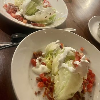 J. Alexander’s San Antonio La Cantera - One order of a wedge salad split in 2 - New American Near Me - San Antonio, Texas