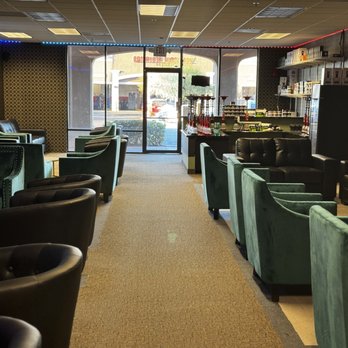 Ignited Hookah Lounge - a row of green chairs - Hookah Bars Near Me - Chandler, Arizona