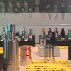 CravinVapes - A display full of tanks.