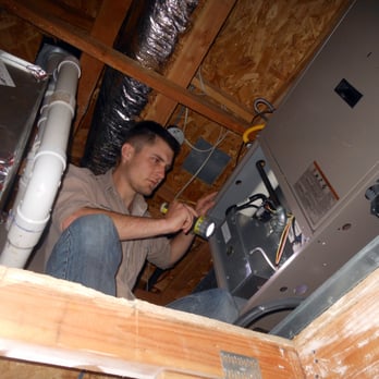 Sentinel Inspection Services - Inspecting a forced air furnace in the attic. - Home Inspectors Near Me Sentinel Inspection Services - Inspecting a forced air furnace in the attic. - Home Inspectors Near Me