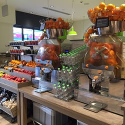 Coop - Fresh juicer in front of store. Very reasonable for a small freshly squeeze yourself container is only CHF3