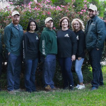 Irish Green Lawn Care - a group of people standing in front of a bush - Lawn Services Near Me - Moore, Oklahoma Irish Green Lawn Care - a group of people standing in front of a bush - Lawn Services Near Me - Moore, Oklahoma