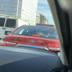 Rock Creek Taxicab Company - Driver from Rock Creek was changing lanes in deadlock traffic. I was getting in another car and he pulled up to the door so I couldnt open