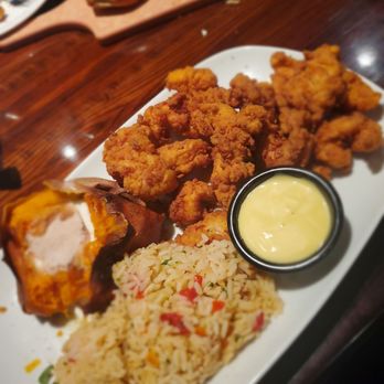 LongHorn Steakhouse - Hand-Breaded Chicken Tenders with Seasoned Rice Pilaf and Sweet Potato - Steakhouses Near Me - Columbia, South Carolina LongHorn Steakhouse - Hand-Breaded Chicken Tenders with Seasoned Rice Pilaf and Sweet Potato - Steakhouses Near Me - Columbia, South Carolina