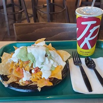 Miguels Jr - Chicken Nachos with sour cream and guacamole drizzled over the top very awesome - Mexican Near Me - Orange, California Miguels Jr - Chicken Nachos with sour cream and guacamole drizzled over the top very awesome - Mexican Near Me - Orange, California