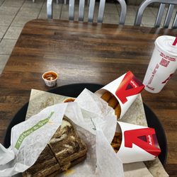 Arby's - Ruben , curly fries, mozzarella sticks, and Coca-Cola three pepper hot sauce