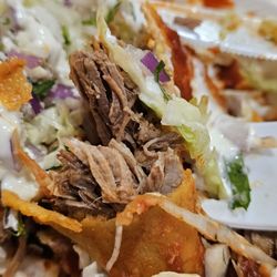La Casa Del Burrito Taco Shop - Close-up of the Shredded Beef of the Shredded Beef Enchiladas.