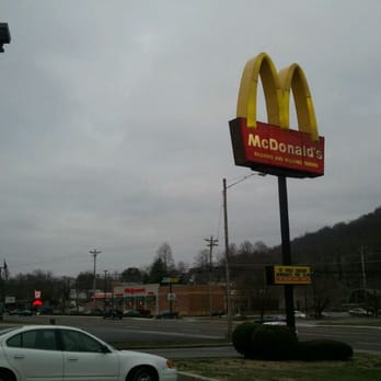 McDonald's - a white car parked in front of a mcdonald's sign - Burgers Near Me - Livingston, Tennessee McDonald's - a white car parked in front of a mcdonald's sign - Burgers Near Me - Livingston, Tennessee