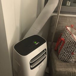 Our room A/C with vent out the window!