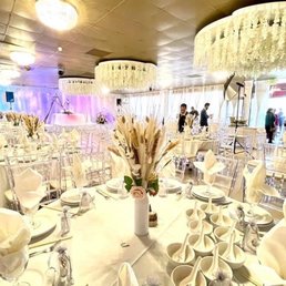 Beautiful wedding guest tables in white. Thank you the owner for suggesting the layout for 13 tables.
