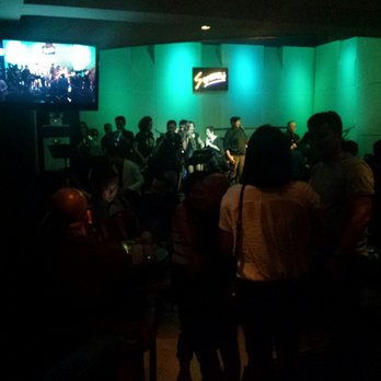 Strumm's - Glass Onion Band on stage. - Bars Near Me - Makati, NCR