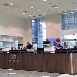 Texas Toyota of Grapevine - People standing around doing nothing.