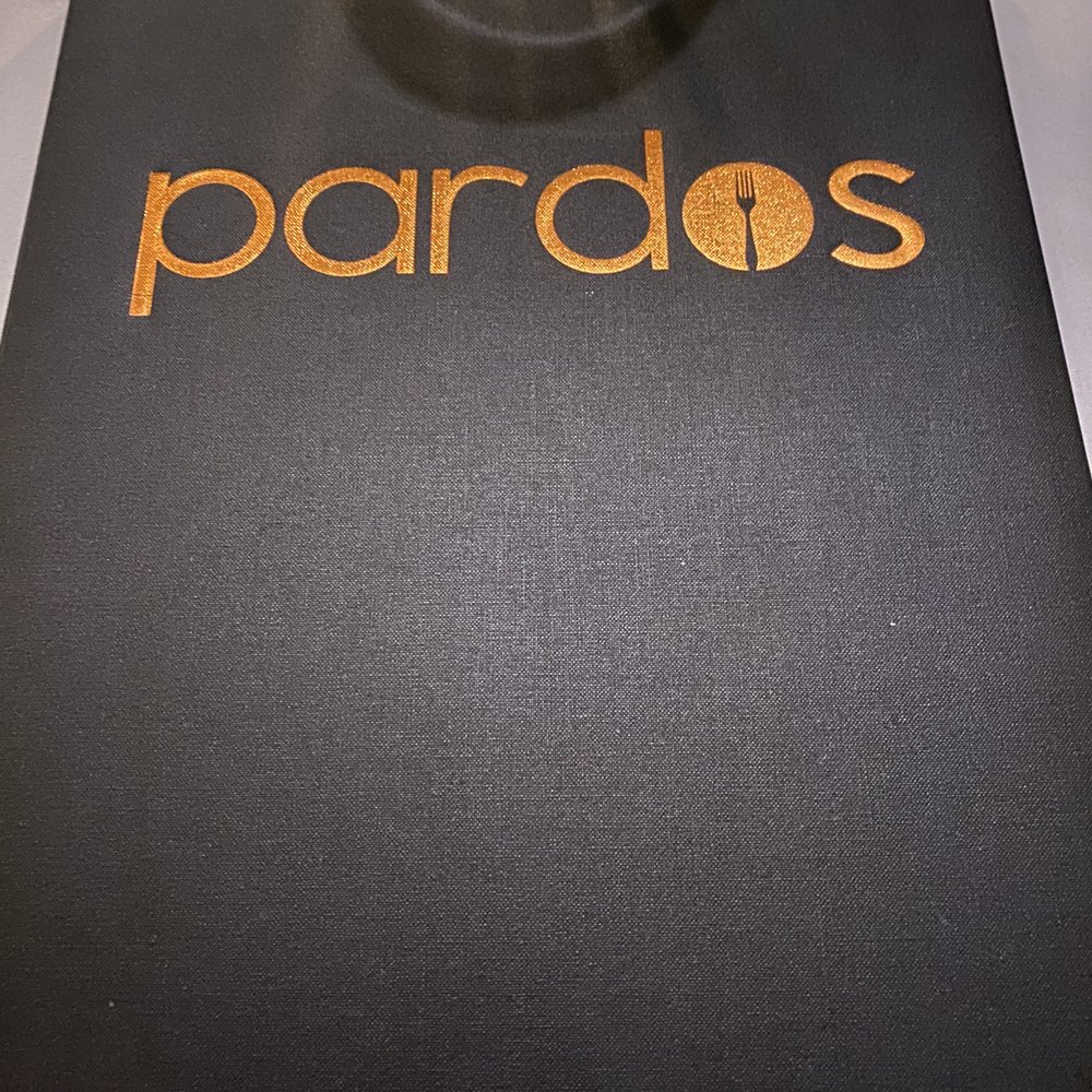 Pardos Bistro - a glass of wine on a table - New American Near Me - Mandeville, Louisiana