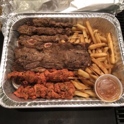 Biggy's junior platter, 1/2 lb each of short ribs, chicken mishkaki and beef mishkaki w/ fries, tamarind sauce and house hot sauce