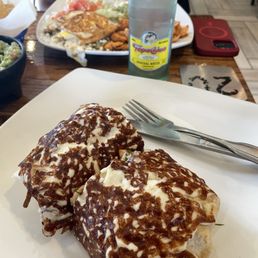 Topo Chico with a cheese/chicken burrito Topo Chico with a cheese/chicken burrito