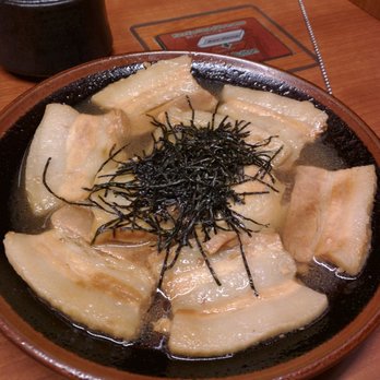 ICHIRAN - Brooklyn - Simmering pork belly, comes with jar of special spices to sprinkle on - Ramen Near Me - Brooklyn, New York