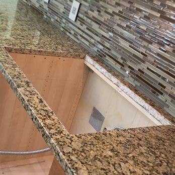 Okse Floors - a kitchen with granite counter tops - Flooring Near Me - Brooklyn, New York Okse Floors - a kitchen with granite counter tops - Flooring Near Me - Brooklyn, New York