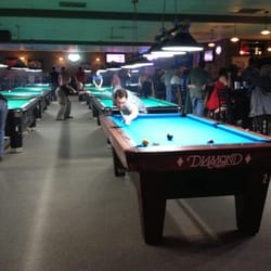 Boondocks Sports Bar & Billiards - Good looking man on a pool table