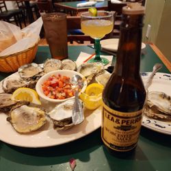Laredo Grill - Beautifully shucked oysters. Topped each with Pico de Gallo and a squirt of lemon juice and of Worcestershire sauce.