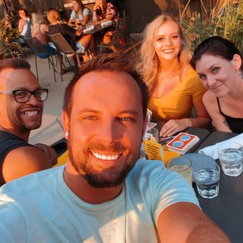 Postino Broadway - On the patio enjoying the sun. - Wine Bars Near Me - Denver, Colorado
