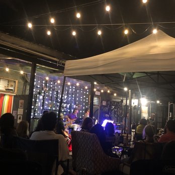 Cafe Kopi - The stage. Pay a little more and you get a seat at a table. Pay a little less and you get a space to put your chair. I loved it. - Coffee & Tea Near Me - Kailua, Hawaii