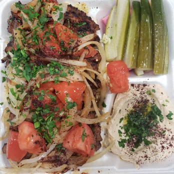 Cafe Du Liban - Beef Filet Kabobs and Grilled Chicken Kabob on a bed of full flavored rice with grilled onions and tomatoes; hummus, pickles and turnips - Middle Eastern Near Me - Tarzana, California
