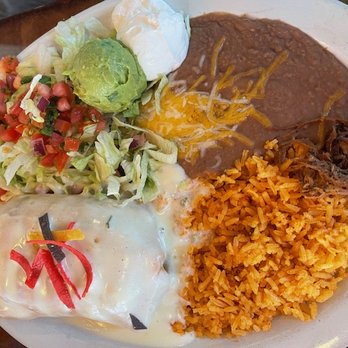 Mi Casa Restaurant - Chimichanga stuffed w/beef. This lunch special comes with all that you see (choice of beans). This is AMAZING! - Mexican Near Me - Riverview, Florida