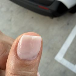 L'Amour Nails Spa - She didn't remove the gelx that was under the nail. Half was still there while she put a new Nail polish over it