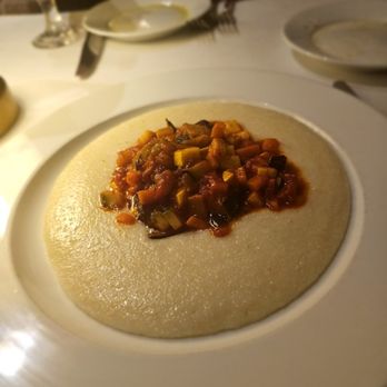 Costa Restaurant - Soft Polenta Special- Mixed veggies, tomato sauce. $24. A bit pricey but pretty tasty. Polenta was alright. Needed more of the tasty topping - Mediterranean Near Me - New York, New York