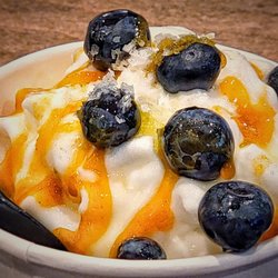 Kairos Mediterranean - Delicious Iced Greek Yogurt with Turmeric Honey, Olive Oil, Fresh Blueberries and Sea Salt.