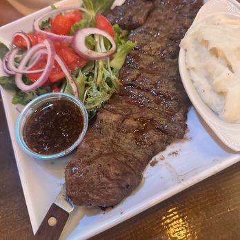 Don Diego Argentinian Steakhouse - Tasty medium skirt steak with two sides: Mashed potatoes and a salad. - Steakhouses Near Me - St. Cloud, Florida Don Diego Argentinian Steakhouse - Tasty medium skirt steak with two sides: Mashed potatoes and a salad. - Steakhouses Near Me - St. Cloud, Florida