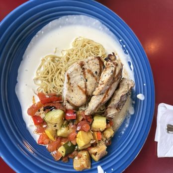 The Kill Devil Grill - Angel hair pasta with marinated chicken, grilled vegetables and a white butter, garlic sauce. - American Near Me - Kill Devil Hills, North Carolina