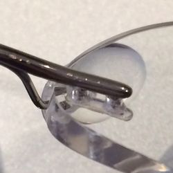 Tomz Optical - Hey, more plier marks! Now I really wish I wouldn't have made these adjustments while the customer was sitting right in front of me...