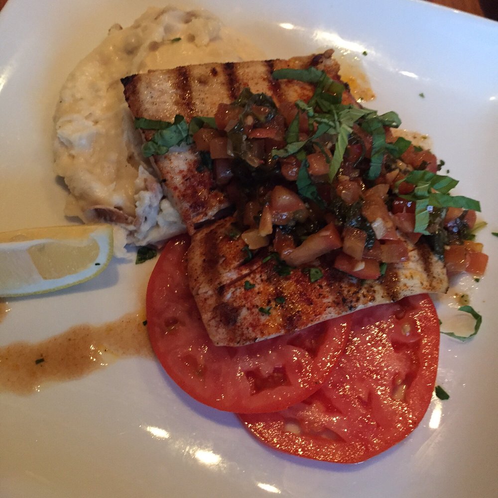 FishBar - Mediterranean Mahimahi, with side dishes of sliced tomatoes and mashed potatoes. - Seafood Near Me - Manhattan Beach, California FishBar - Mediterranean Mahimahi, with side dishes of sliced tomatoes and mashed potatoes. - Seafood Near Me - Manhattan Beach, California
