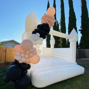 Bounce Bae Rentals - White Bounce House With Balloon Garland - Bounce House Rentals Near Me Bounce Bae Rentals - White Bounce House With Balloon Garland - Bounce House Rentals Near Me
