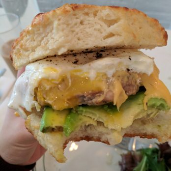 POST - Inside: Runny yolk, melted cheese goodness. Tip: when it starts to get messy and drippy, flip the whole sandwich upside down to eat - Breakfast & Brunch Near Me - New York, New York