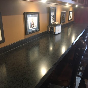 Small Batch Soups by Soupremacy - Counter seating lining the wall with celeb photos for decor. Other celebs' names were spelled correctly. - Salad Near Me - Indianapolis, Indiana