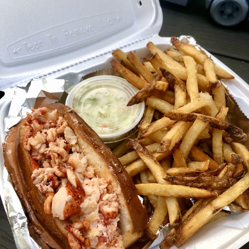 DB's Seafood - Hot lobster roll platter: hot lobster roll, fries, and cole slaw - Seafood Near Me - Bethany Beach, Delaware DB's Seafood - Hot lobster roll platter: hot lobster roll, fries, and cole slaw - Seafood Near Me - Bethany Beach, Delaware