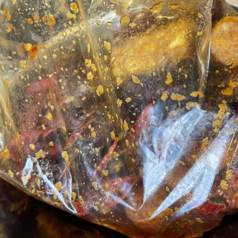 Crawfish Cafe - Served in a bag on top of a metal bowl. Nice touch to the bowls since it helps keep food warm and is less messy. - Seafood Near Me - Houston, Texas