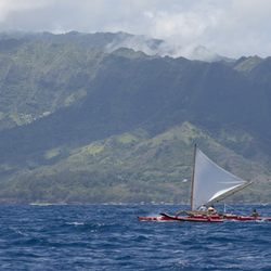Beautiful Kupaaloha, the traditional Hawaiian sailing canoe in Hanalei Bay.