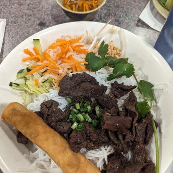 Pho Saigon - Lemongrass beef and eggroll noodle salad, about $11.50. Beef tasted old and lacked lemongrass flavor. - Vietnamese Near Me - Houston, Texas