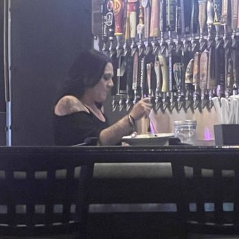 Pizza Rock - Bartender stuffing her face in full view of everybody while working. - Pizza Near Me - Henderson, Nevada