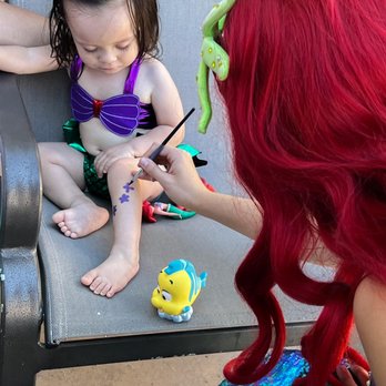 Royal Entertainers - Ariel painting on my babies leg! Giving her a tattoo! - Party & Event Planning Near Me - San Diego, California Royal Entertainers - Ariel painting on my babies leg! Giving her a tattoo! - Party & Event Planning Near Me - San Diego, California