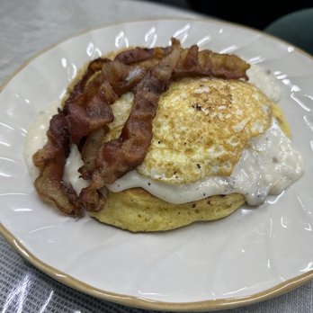 The Whippoorwill Diner - Stacked Cornbread with Sausage Gravy, Eggs and Bacon - American Near Me - Somerset , Kentucky The Whippoorwill Diner - Stacked Cornbread with Sausage Gravy, Eggs and Bacon - American Near Me - Somerset , Kentucky