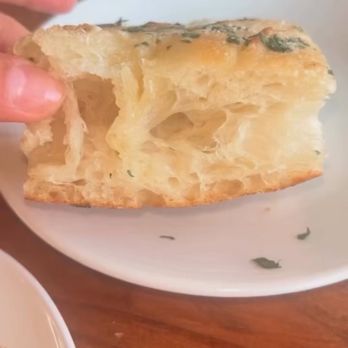 Tucker's Italian - Focaccia with basil and garlic. - Italian Near Me - San Antonio, Texas Tucker's Italian - Focaccia with basil and garlic. - Italian Near Me - San Antonio, Texas