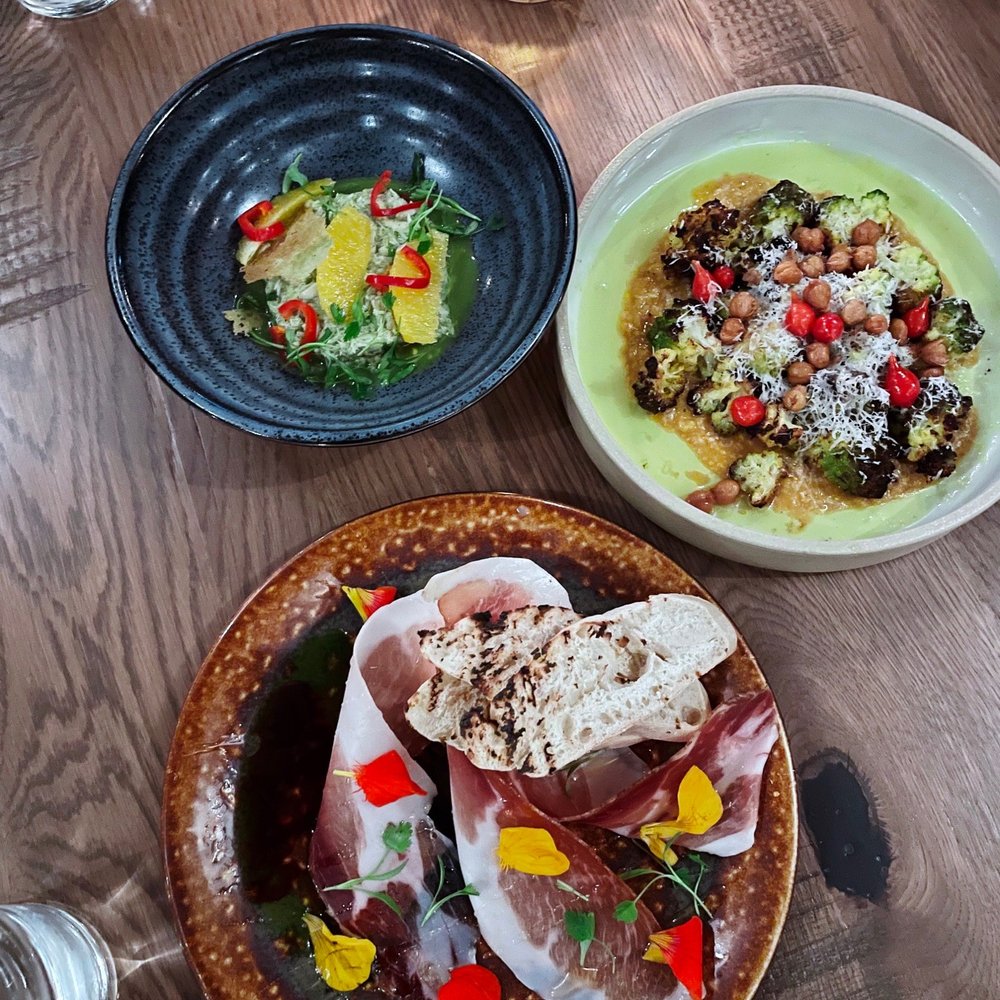 Costa Kitchen & Bar - Crab (top left), roasted cauliflower (top right), speck and burrata (bottom) - New American Near Me - Santa Barbara, California Costa Kitchen & Bar - Crab (top left), roasted cauliflower (top right), speck and burrata (bottom) - New American Near Me - Santa Barbara, California